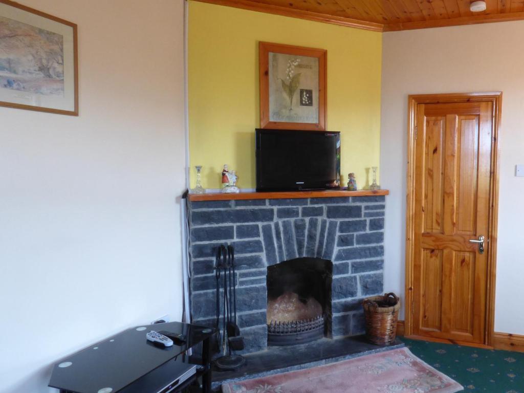TV a/nebo společenská místnost v ubytování Seaview Cottage