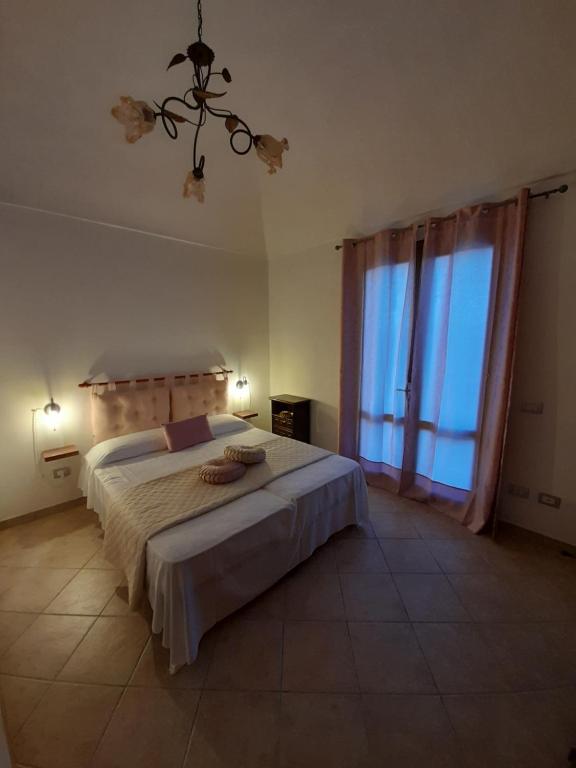 Ліжко або ліжка в номері Casa di Jacu