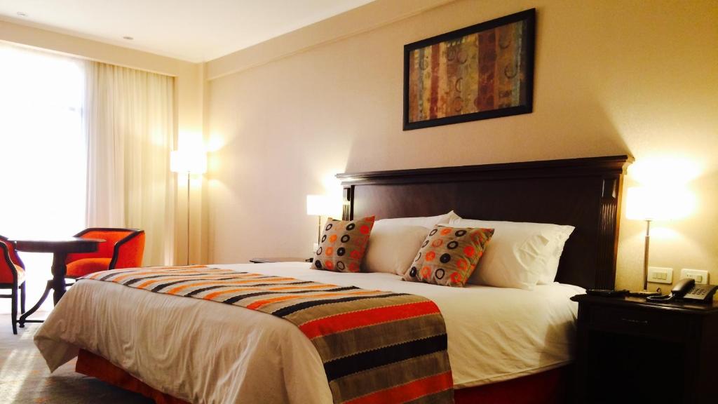 Postel nebo postele na pokoji v ubytování Carnaval Hotel Casino