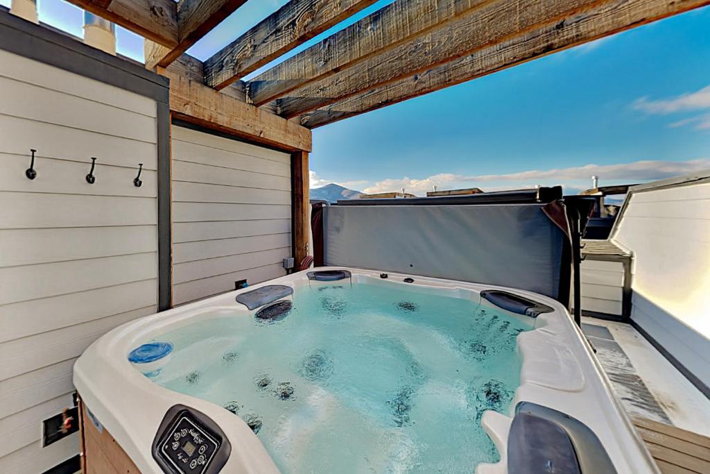 a jacuzzi tub on the back of a house at Nevis at Newpark Unit 4 in Park City