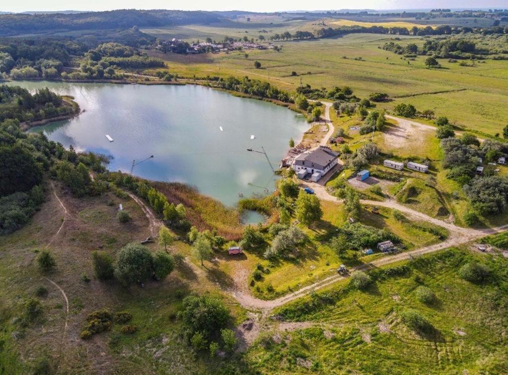 an aerial view of a lake with a house at Bungalow, Adler am See in Zirkow