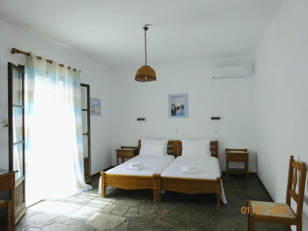 Ένα ή περισσότερα κρεβάτια σε δωμάτιο στο Alkionides Bungalows