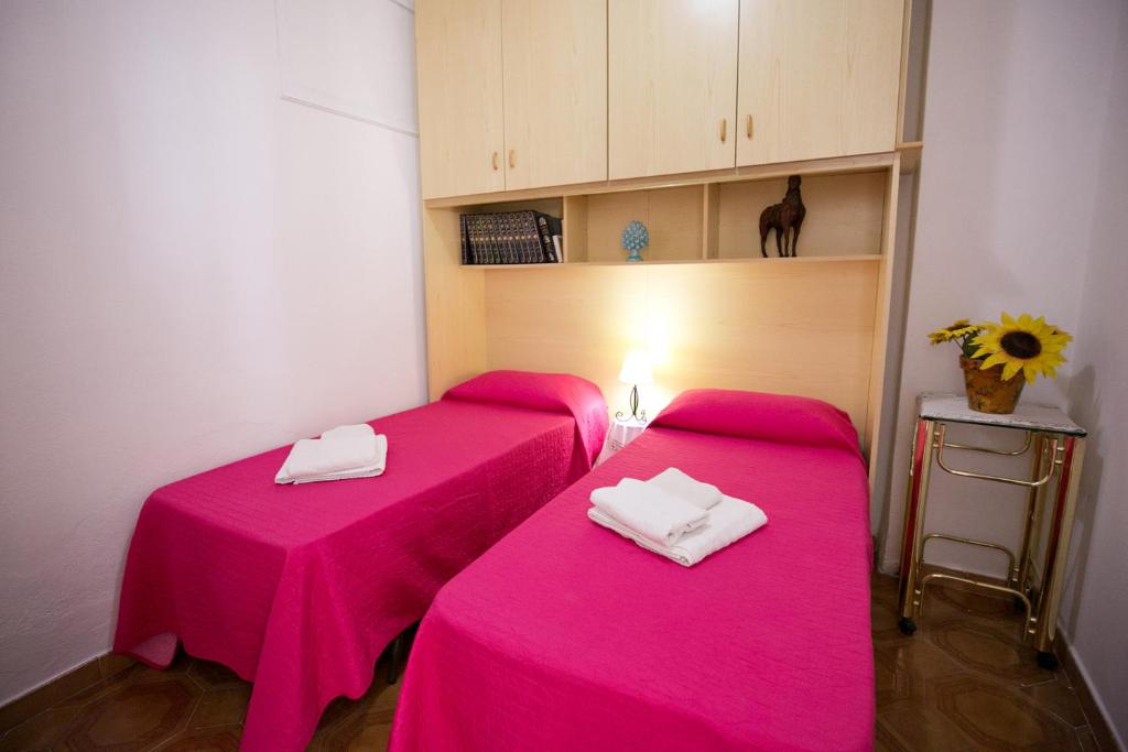 Posteľ alebo postele v izbe v ubytovaní Casa Rosy