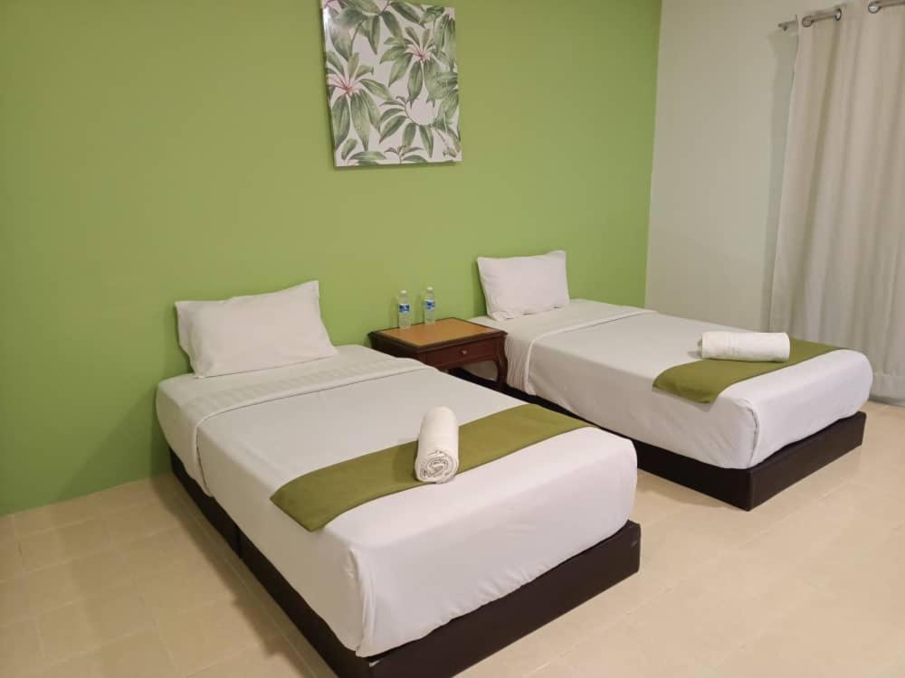 Postel nebo postele na pokoji v ubytování SANDY GARDEN RESORT LANGKAWI