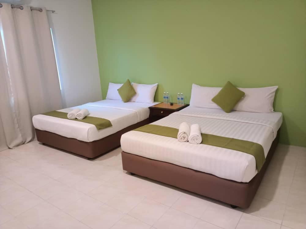 Postel nebo postele na pokoji v ubytování SANDY GARDEN RESORT LANGKAWI