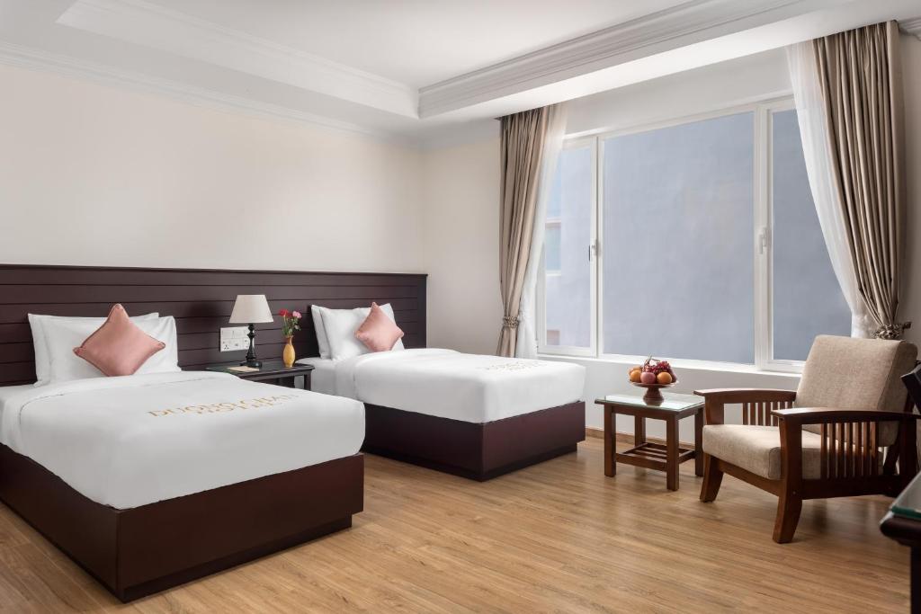 Postel nebo postele na pokoji v ubytování Duong Chan Hotel