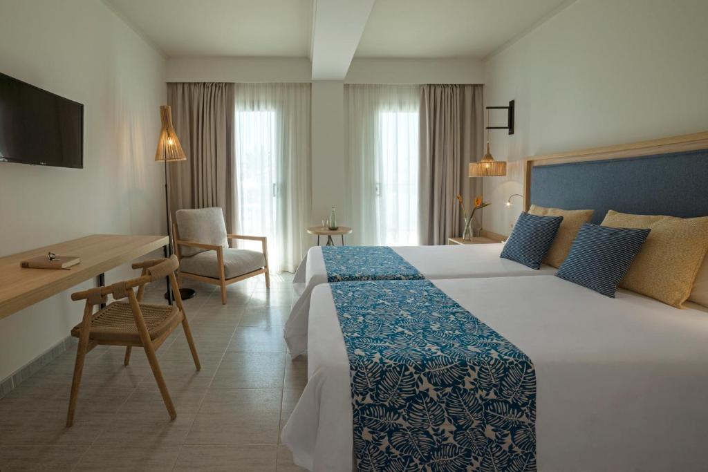 Postel nebo postele na pokoji v ubytování Hotel Cabogata Jardín