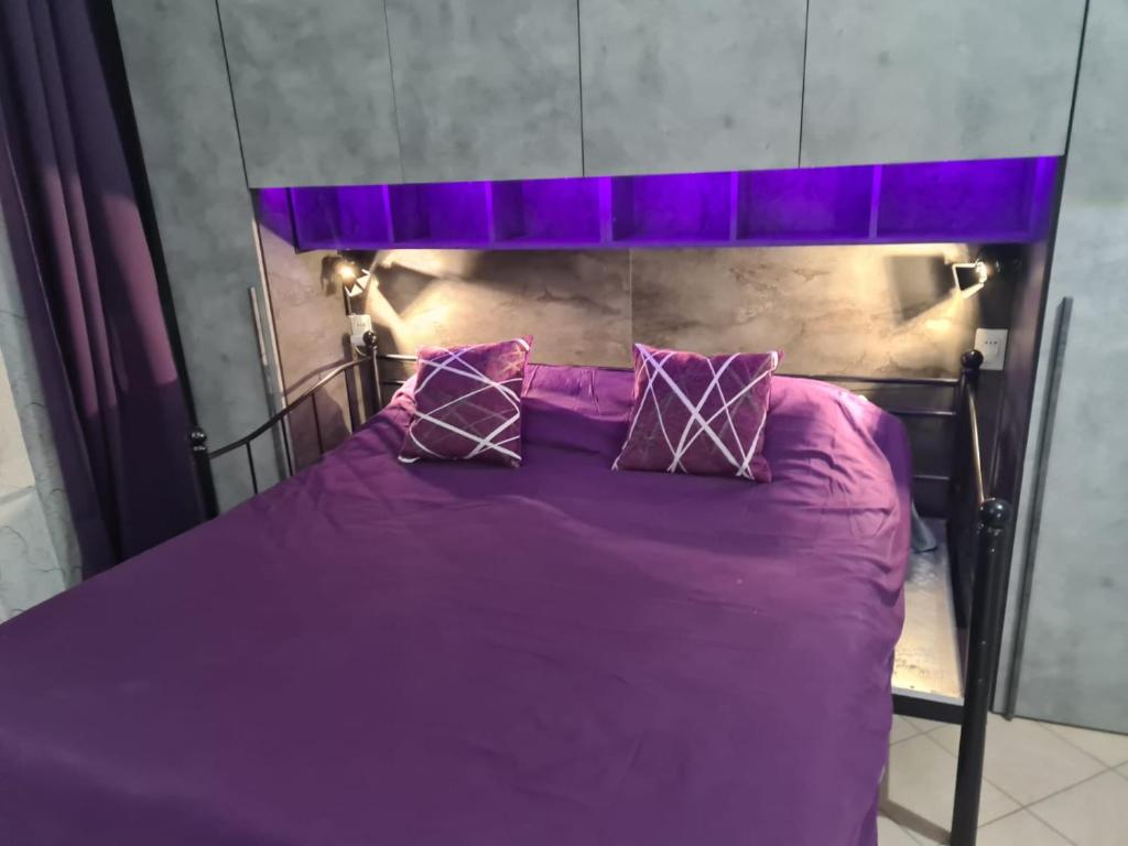 Łóżko lub łóżka w pokoju w obiekcie Silver Home