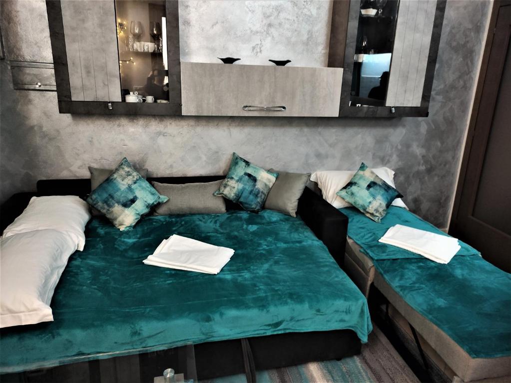 Łóżko lub łóżka w pokoju w obiekcie Silver Home