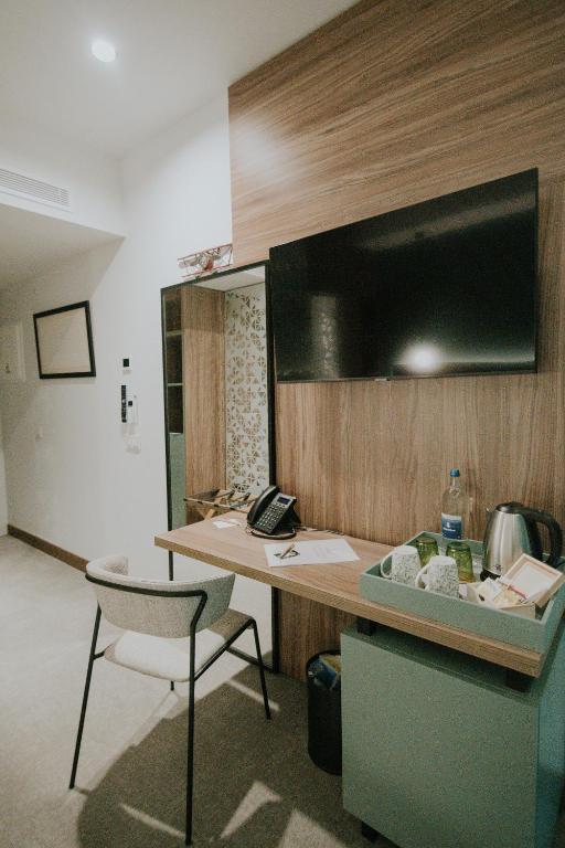 Een TV en/of entertainmentcenter bij Catalina Plaza Hotel Sostenible
