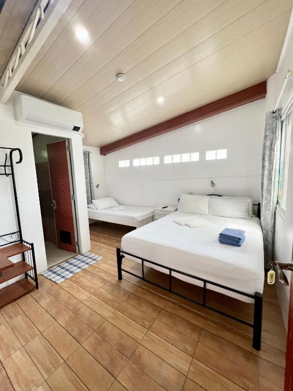 Postel nebo postele na pokoji v ubytování Balai Tinay Guesthouse