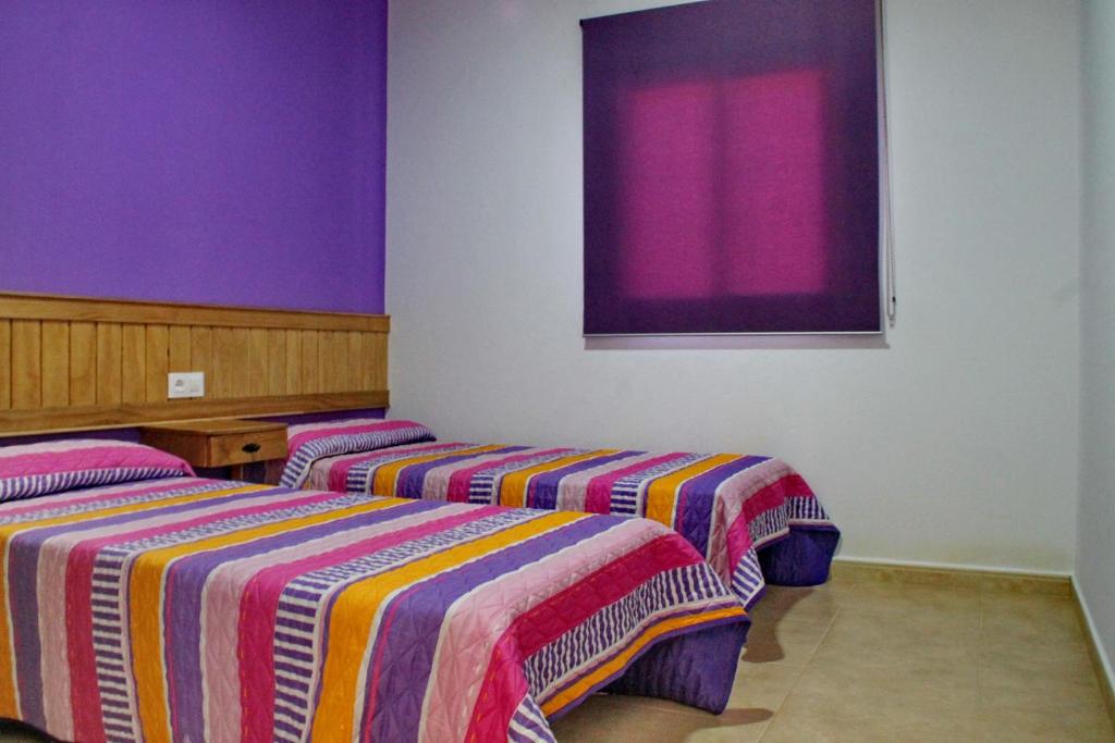 A bed or beds in a room at Chalet Arroyo Peñuelas 41