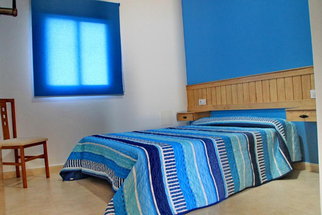 A bed or beds in a room at Chalet Arroyo Peñuelas 41