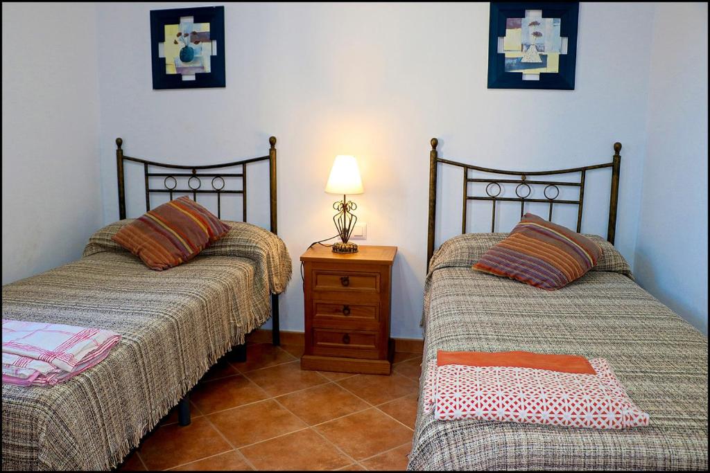 Łóżko lub łóżka w pokoju w obiekcie Chalet con piscina privada