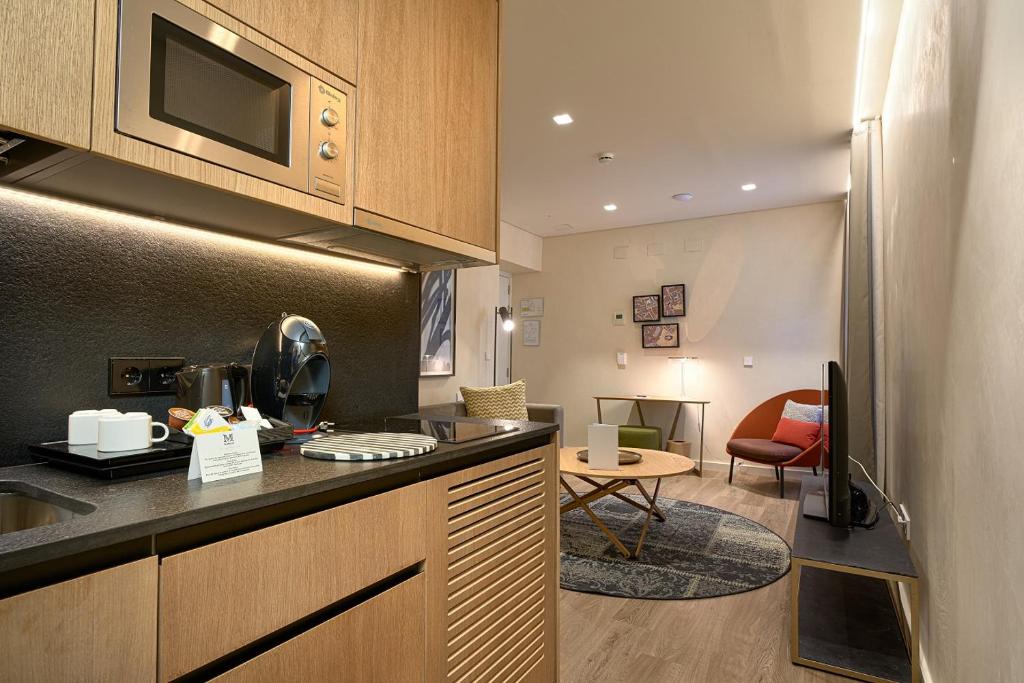 Kuchyň nebo kuchyňský kout v ubytování Suites Murillo Plaza Sta. Cruz