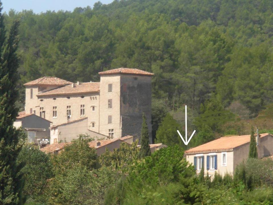 a large building in the middle of a mountain at Le Gîte des Templiers à Montfort-sur-Argens in Montfort-sur-Argens