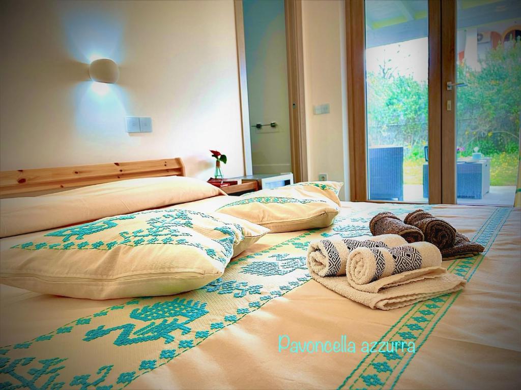 Postelja oz. postelje v sobi nastanitve B&B Le pavoncelle sarde