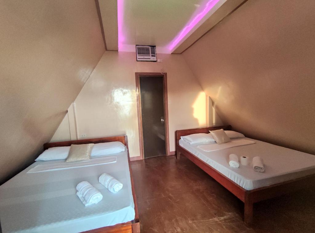 Postel nebo postele na pokoji v ubytování Acuario Beach Inn