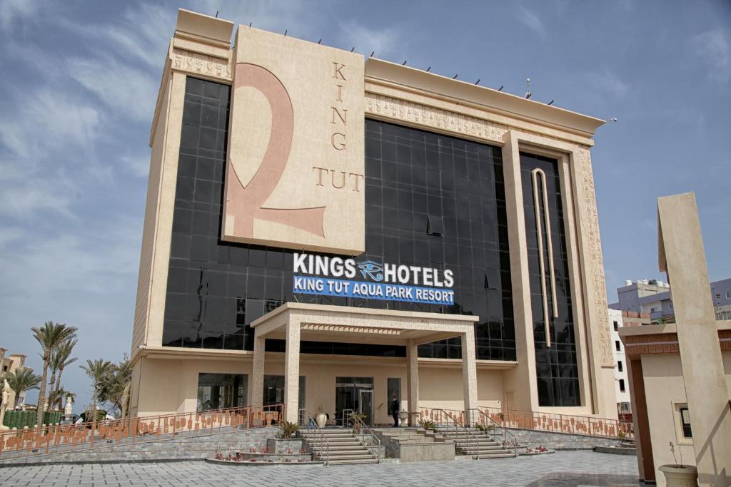 a building with a sign on the side of it at King Tut Aqua Park Beach Resort in Hurghada