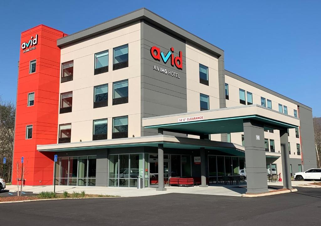 a large building with a krispy kremeasteryasteryasteryasteryasteryastery at avid hotels - Salem, an IHG Hotel in Salem