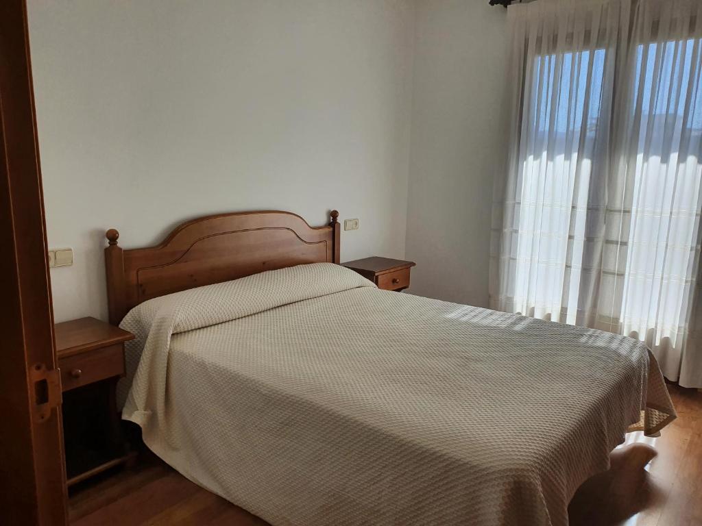 Postel nebo postele na pokoji v ubytování Hostal Apolo XI