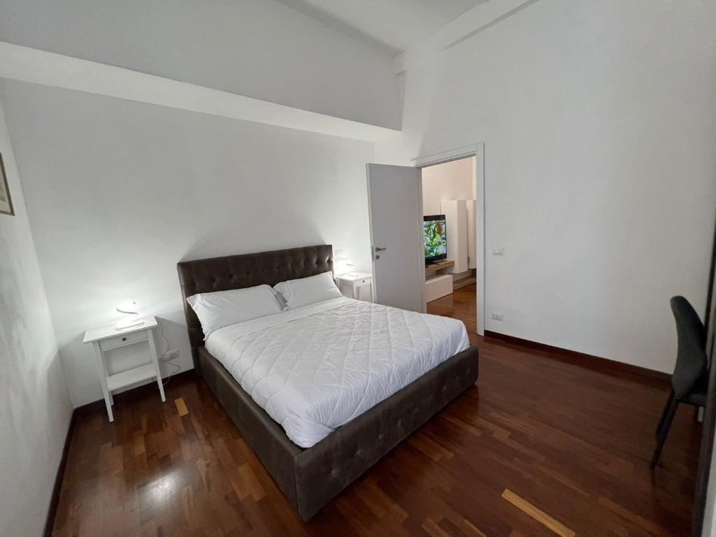 A bed or beds in a room at StarHome Colosseo