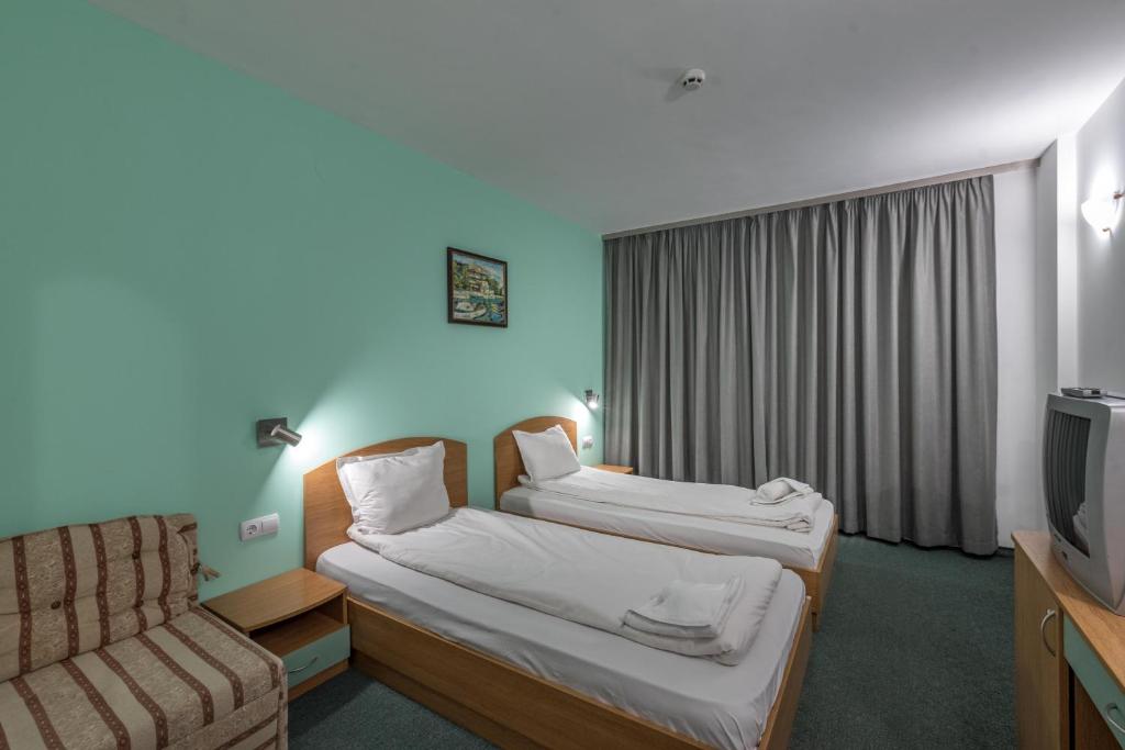 Postel nebo postele na pokoji v ubytování Hotel Iceberg Bansko