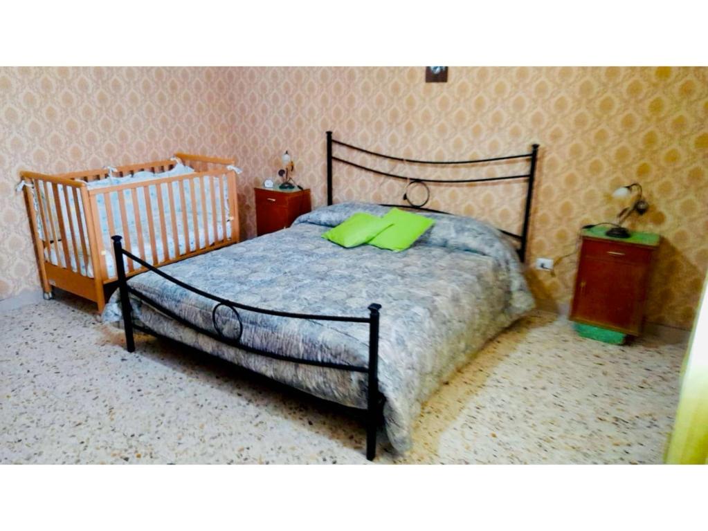 Łóżko lub łóżka w pokoju w obiekcie LE RADICI