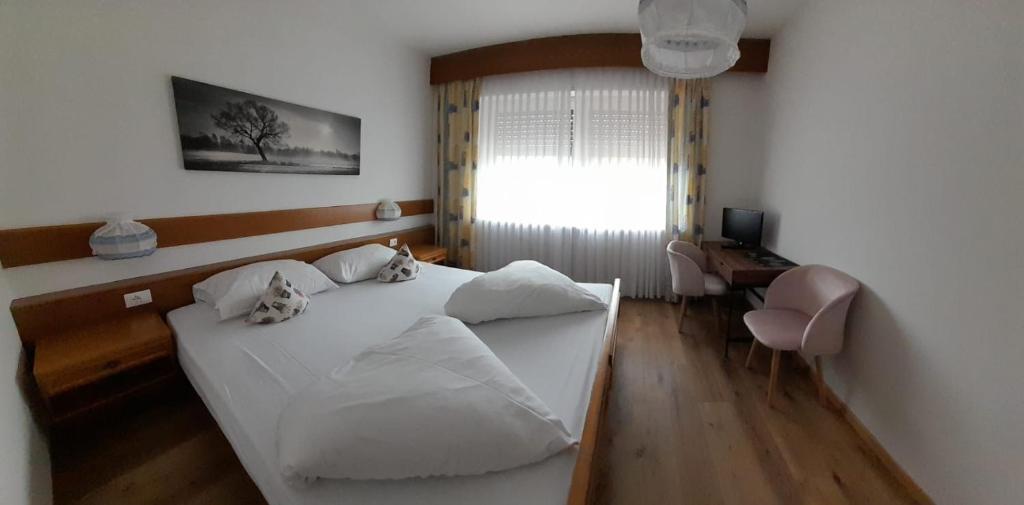 Postel nebo postele na pokoji v ubytování Landhaus Weingut