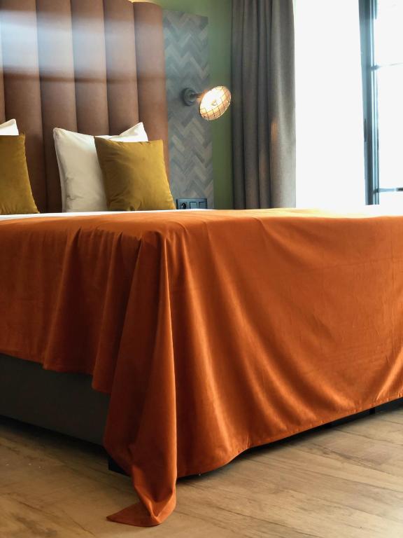 Postel nebo postele na pokoji v ubytování Van der Valk Hotel Dennenhof