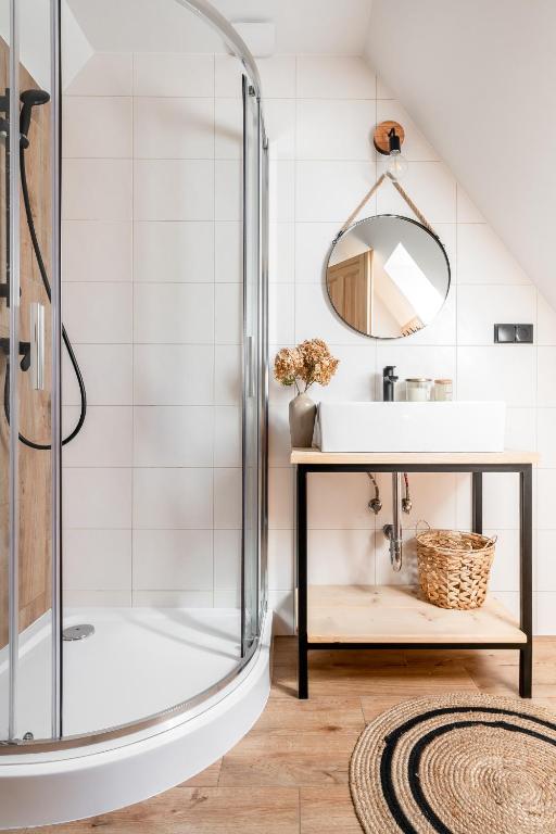 a bathroom with a sink and a shower at Dolina in Zakopane