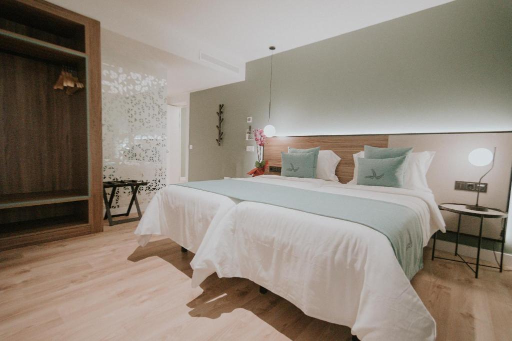 Voodi või voodid majutusasutuse Hotel Catalina Plaza Sostenible toas
