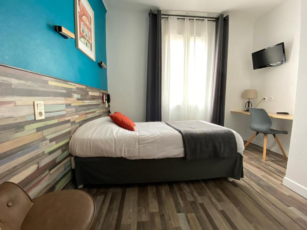 Postel nebo postele na pokoji v ubytování REV HÔTEL