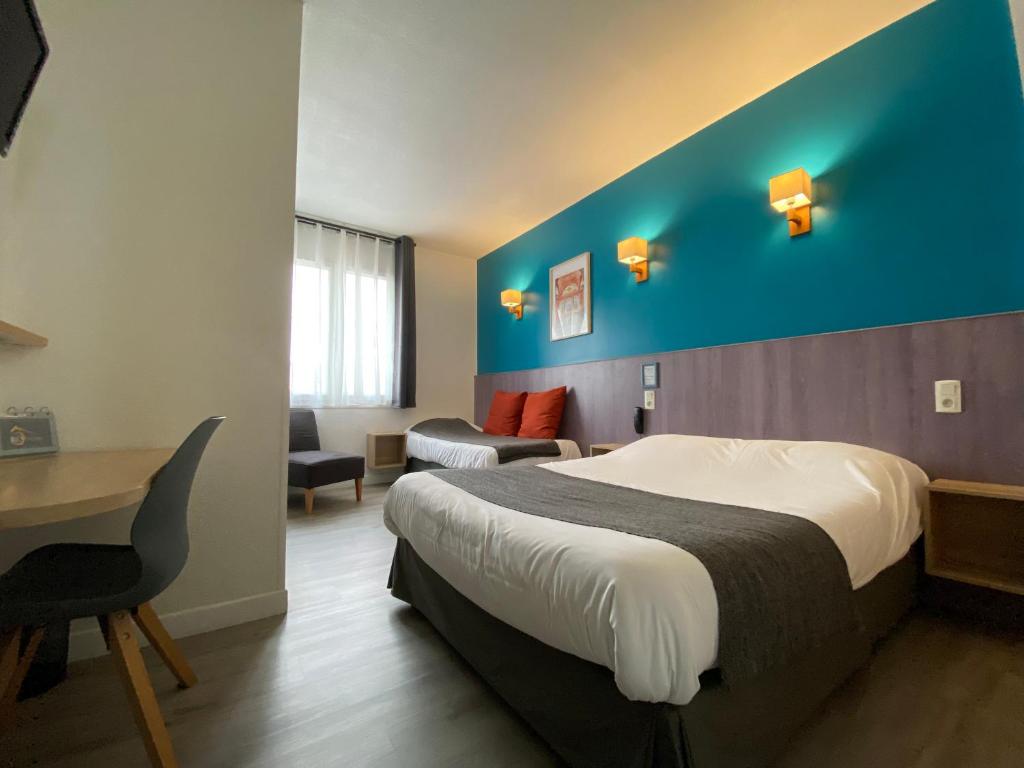 Postel nebo postele na pokoji v ubytování REV HÔTEL