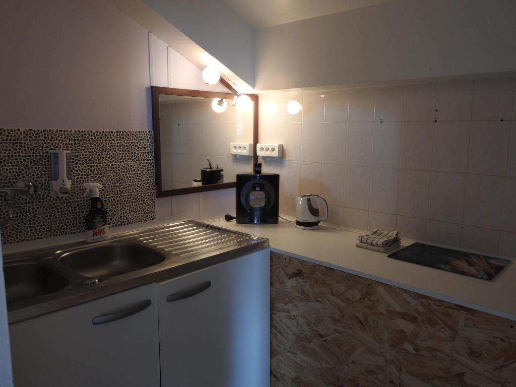 Kuchyň nebo kuchyňský kout v ubytování Le Chalet
