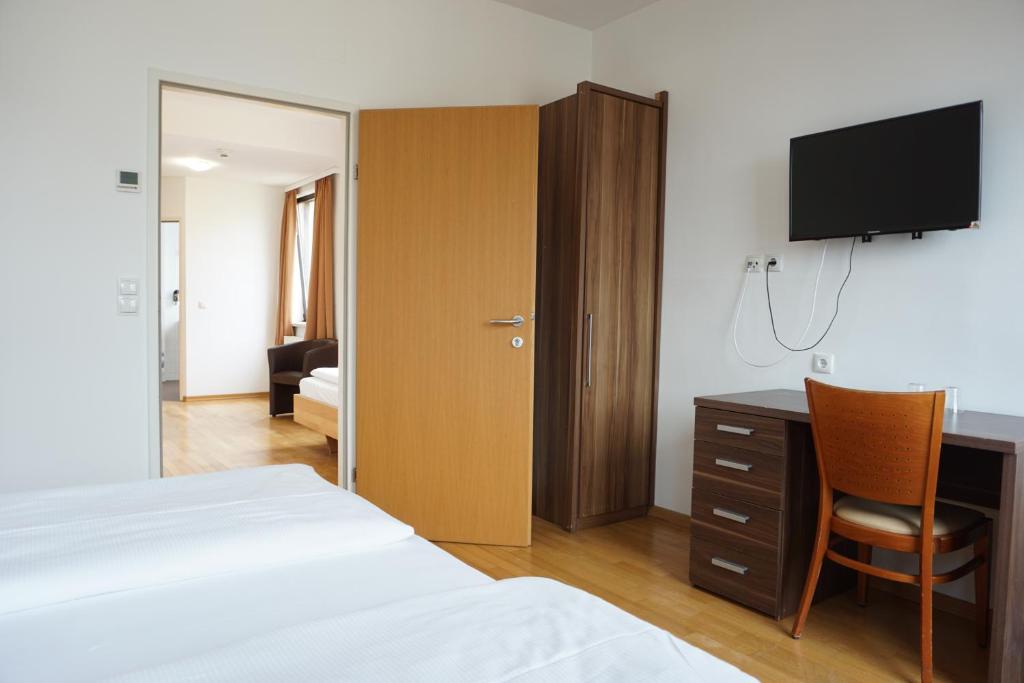 Postel nebo postele na pokoji v ubytování Hotel Kaffeemühle