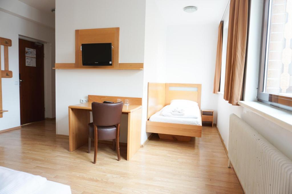 TV a/nebo společenská místnost v ubytování Hotel Kaffeemühle