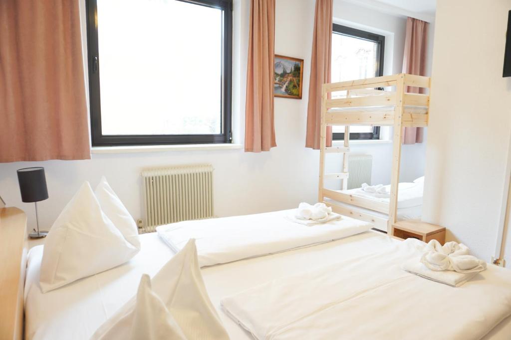 Postel nebo postele na pokoji v ubytování Hotel Kaffeemühle