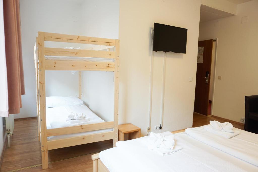 Postel nebo postele na pokoji v ubytování Hotel Kaffeemühle