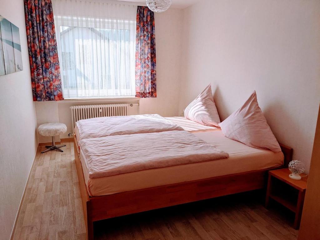Postel nebo postele na pokoji v ubytování Haus Am Battenstein