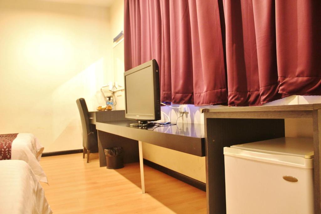 Postel nebo postele na pokoji v ubytování Prince Hotel