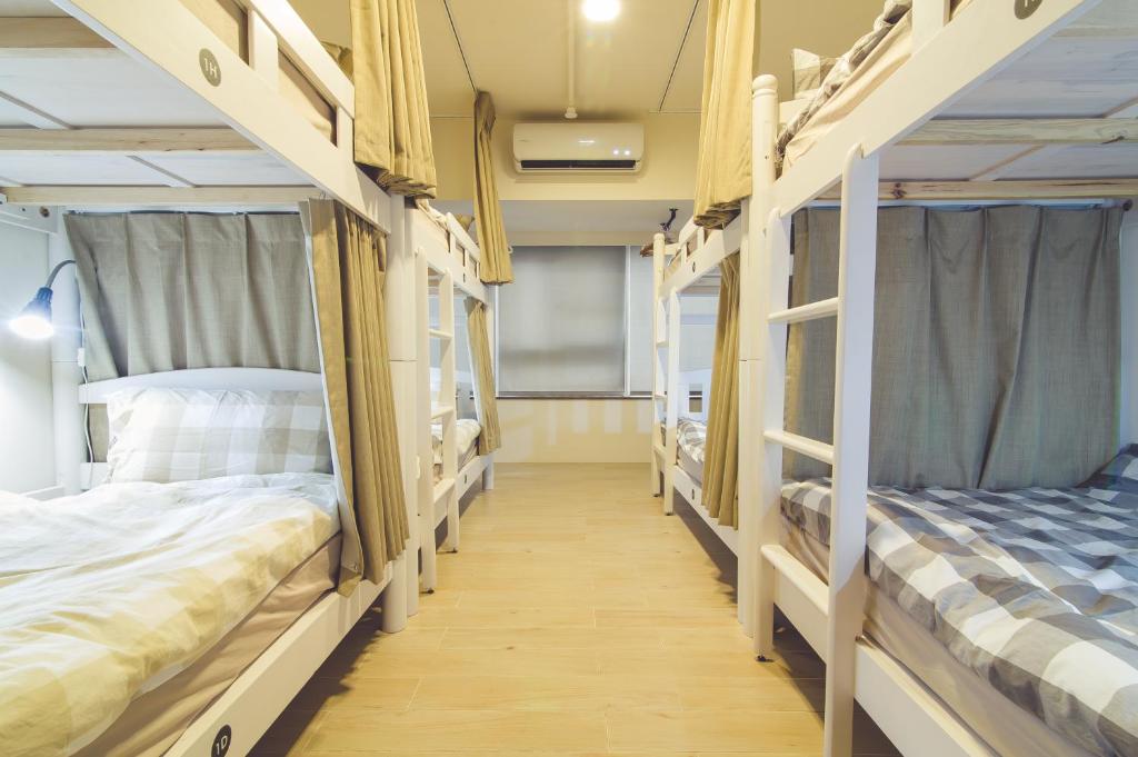 Letto o letti in una camera di Ahiruyah Guesthouse