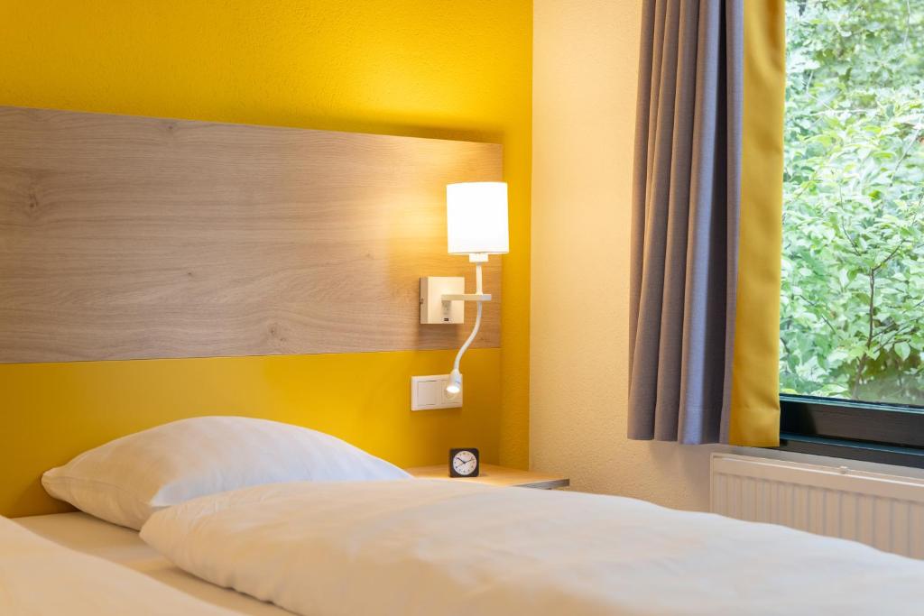 Postel nebo postele na pokoji v ubytování Center Parcs Vossemeren