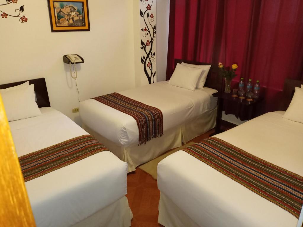 Ein Bett oder Betten in einem Zimmer der Unterkunft Inkas Land