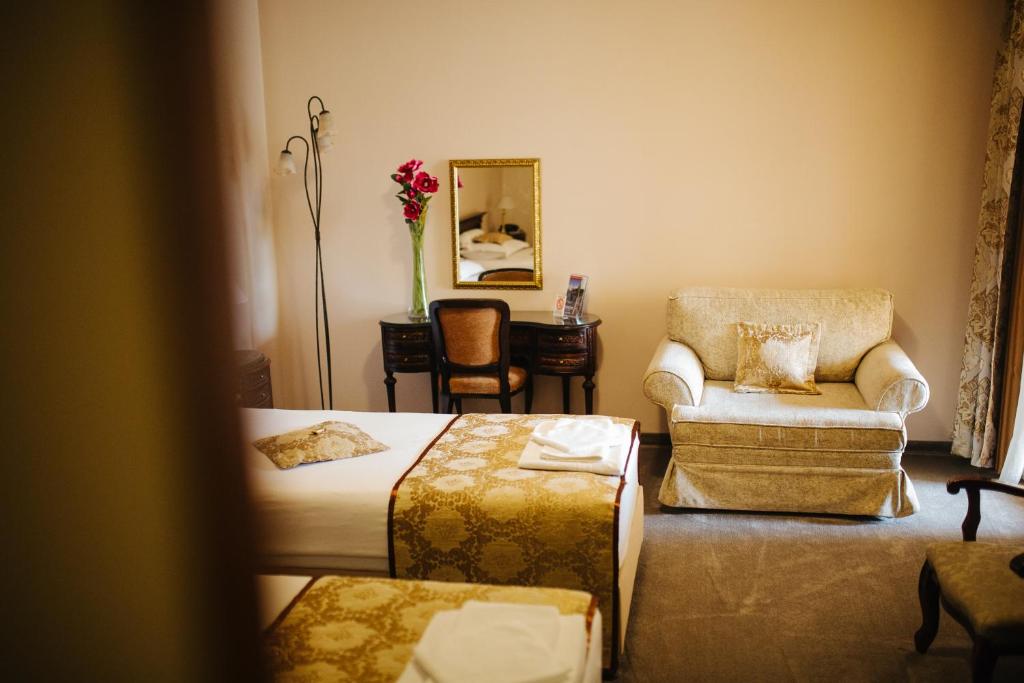 Postel nebo postele na pokoji v ubytování Garni Hotel Andric