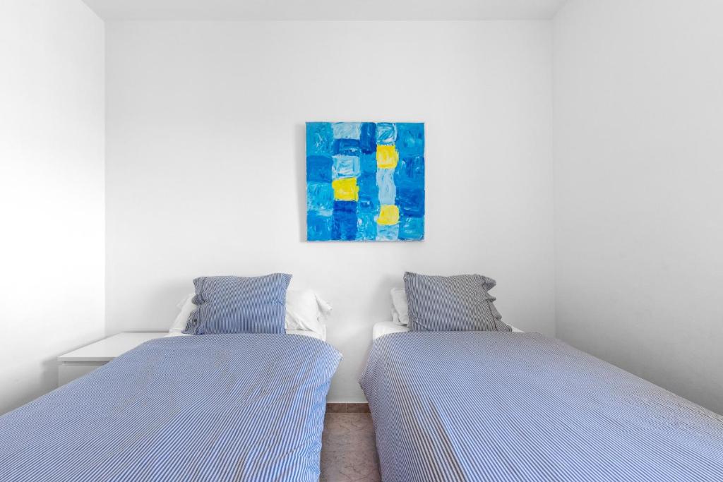 Posteľ alebo postele v izbe v ubytovaní Townhouse Calahonda