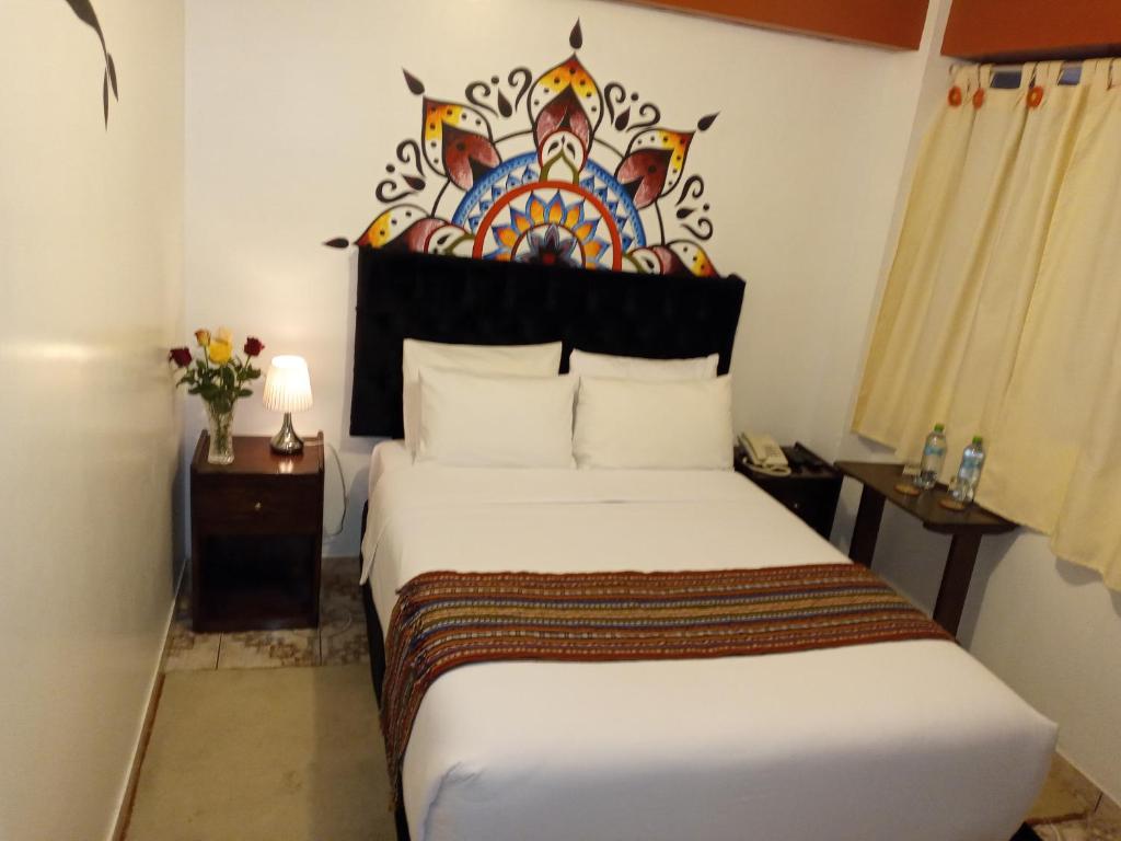 Ein Bett oder Betten in einem Zimmer der Unterkunft Inkas Land