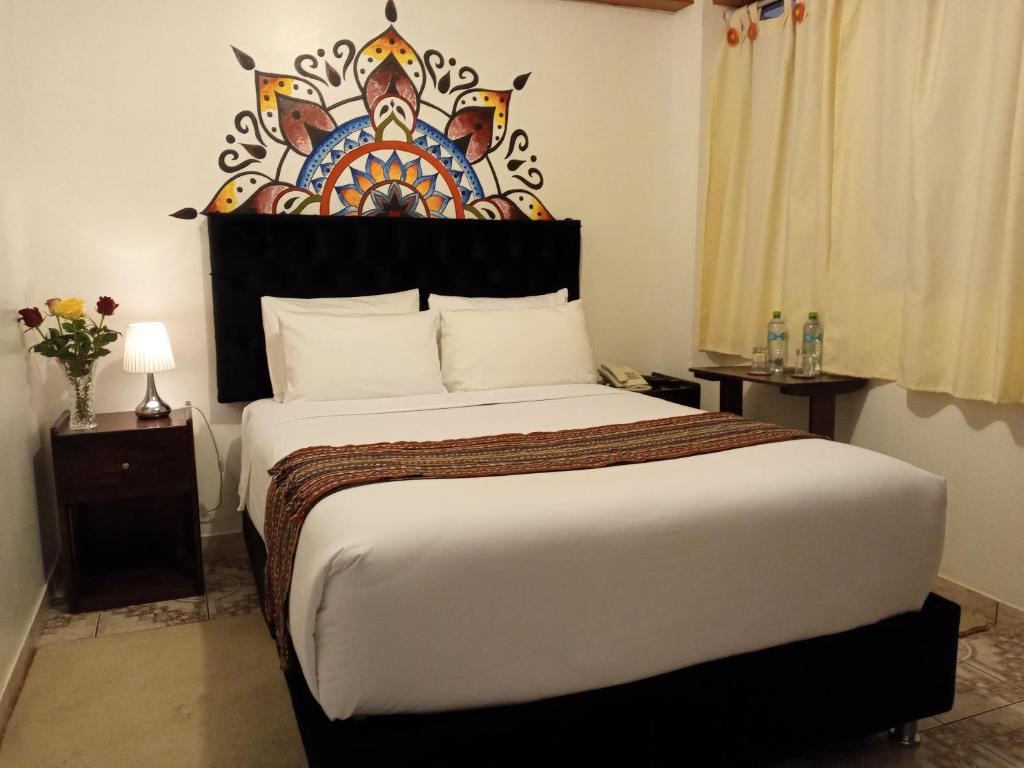 Ein Bett oder Betten in einem Zimmer der Unterkunft Inkas Land