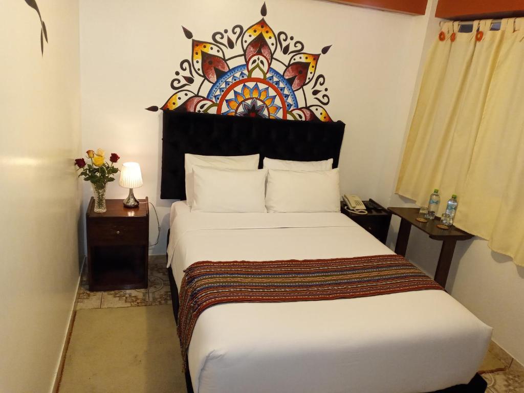 Ein Bett oder Betten in einem Zimmer der Unterkunft Inkas Land