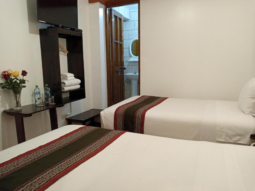 Ein Bett oder Betten in einem Zimmer der Unterkunft Inkas Land